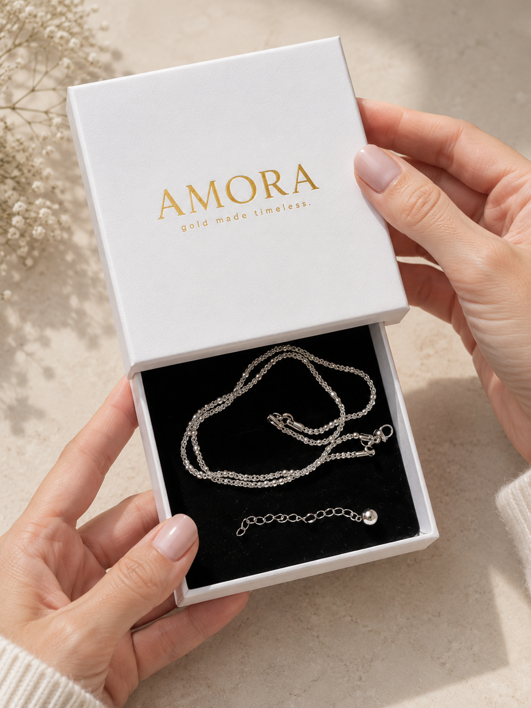 AMORA gift box being opened